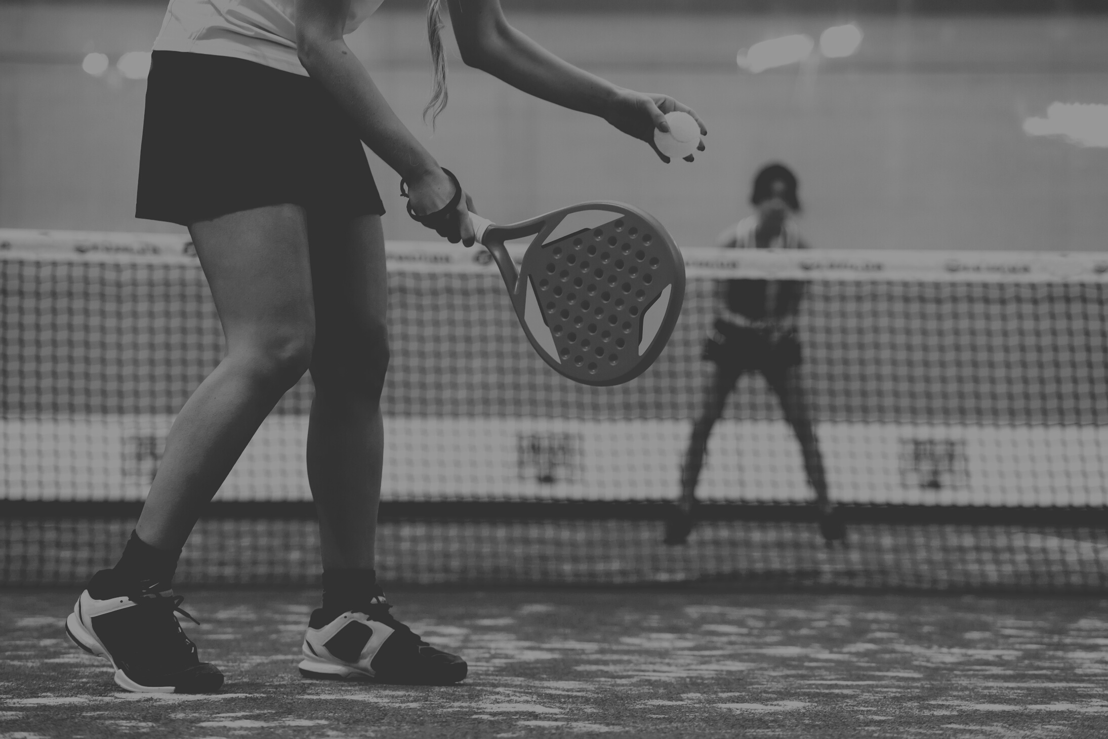 Two Young Women Playing Paddle Tennis